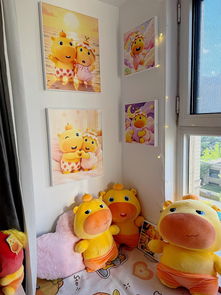 Framed Lulu and Lumi artwork above plush figures in a bright studio window corner