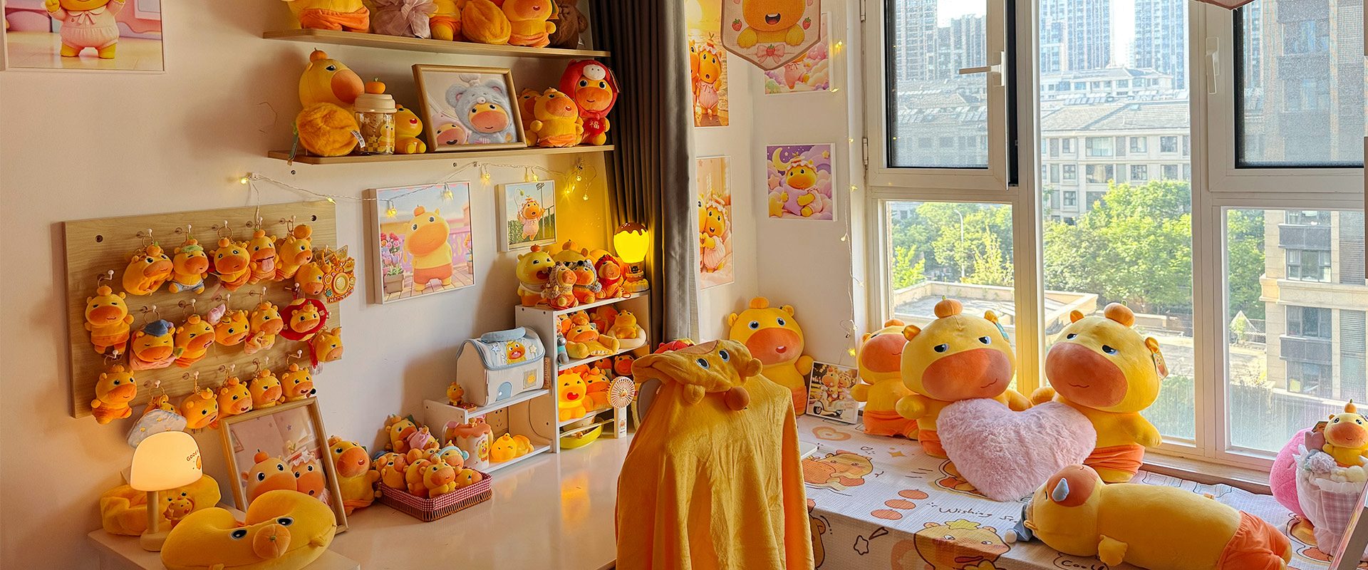 A sunlit CapyLulumi studio room filled with Lulu and Lumi artwork and merchandise